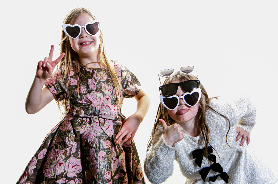 2 children having fun in a photo booths