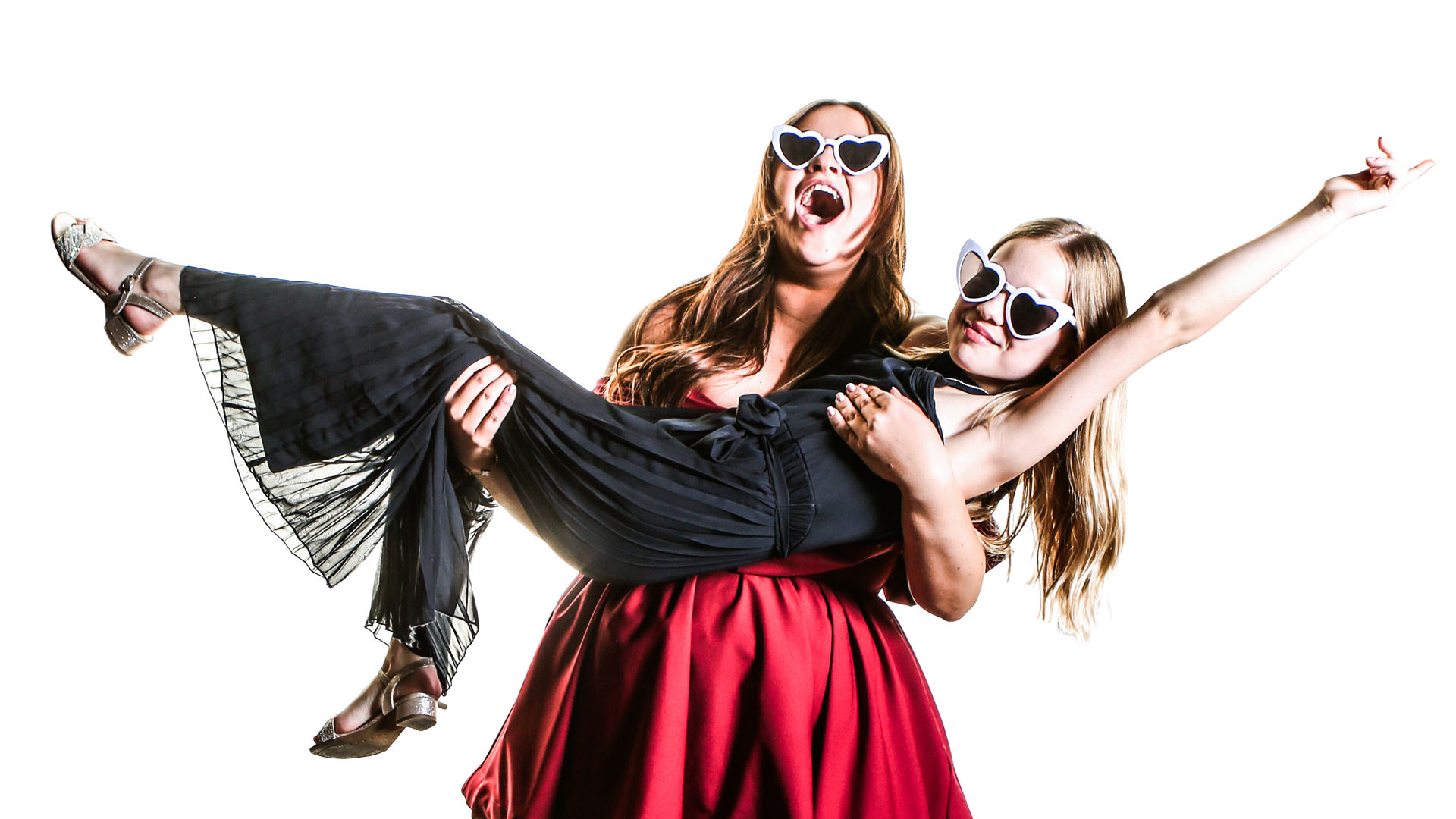 Wedding guests in studio photo booth wearing heart sunglasses – fun wedding photo booth hire Dorset